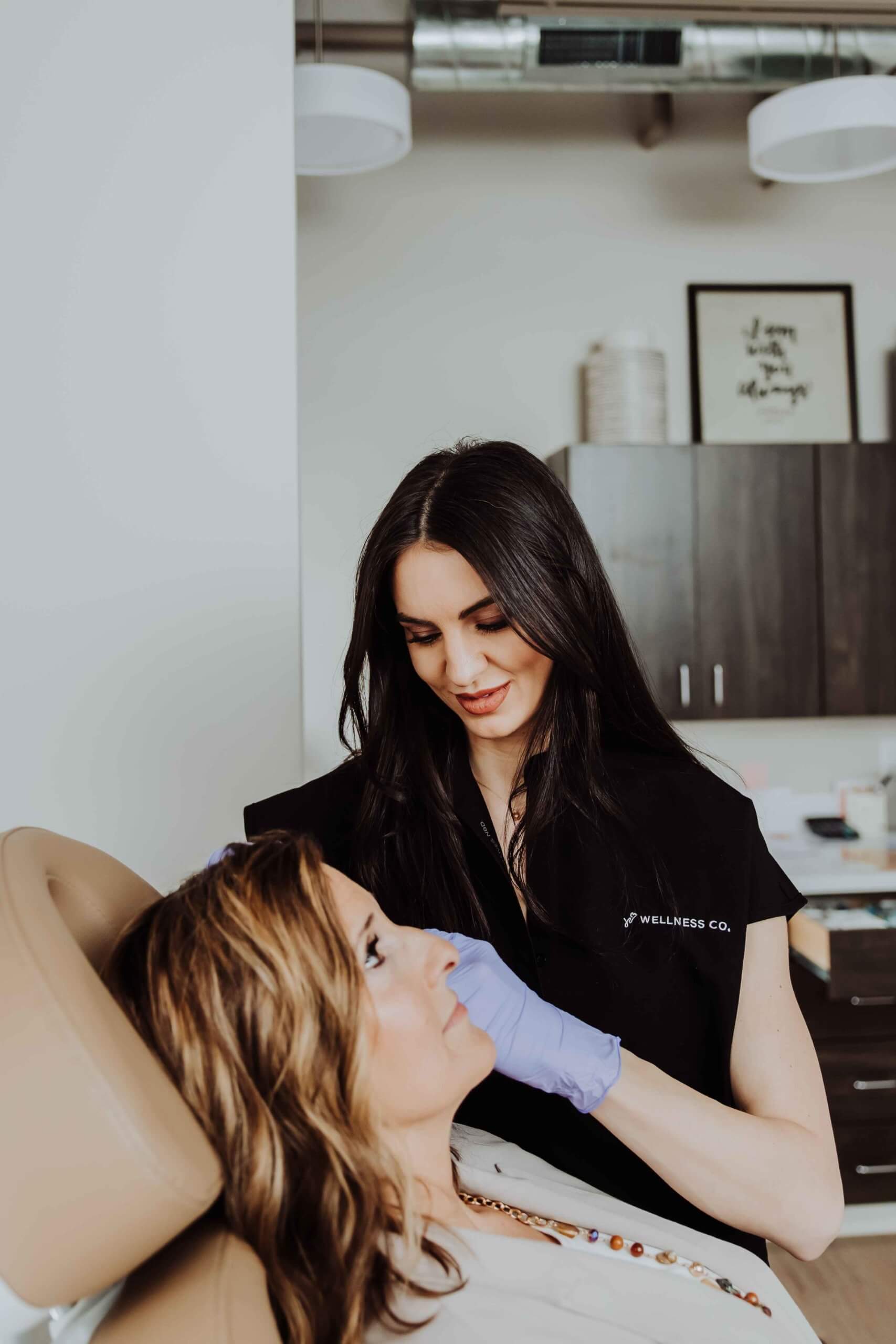 Esthetician preparing for aesthetic treatment | Wellness Co. | Zeeland, MI