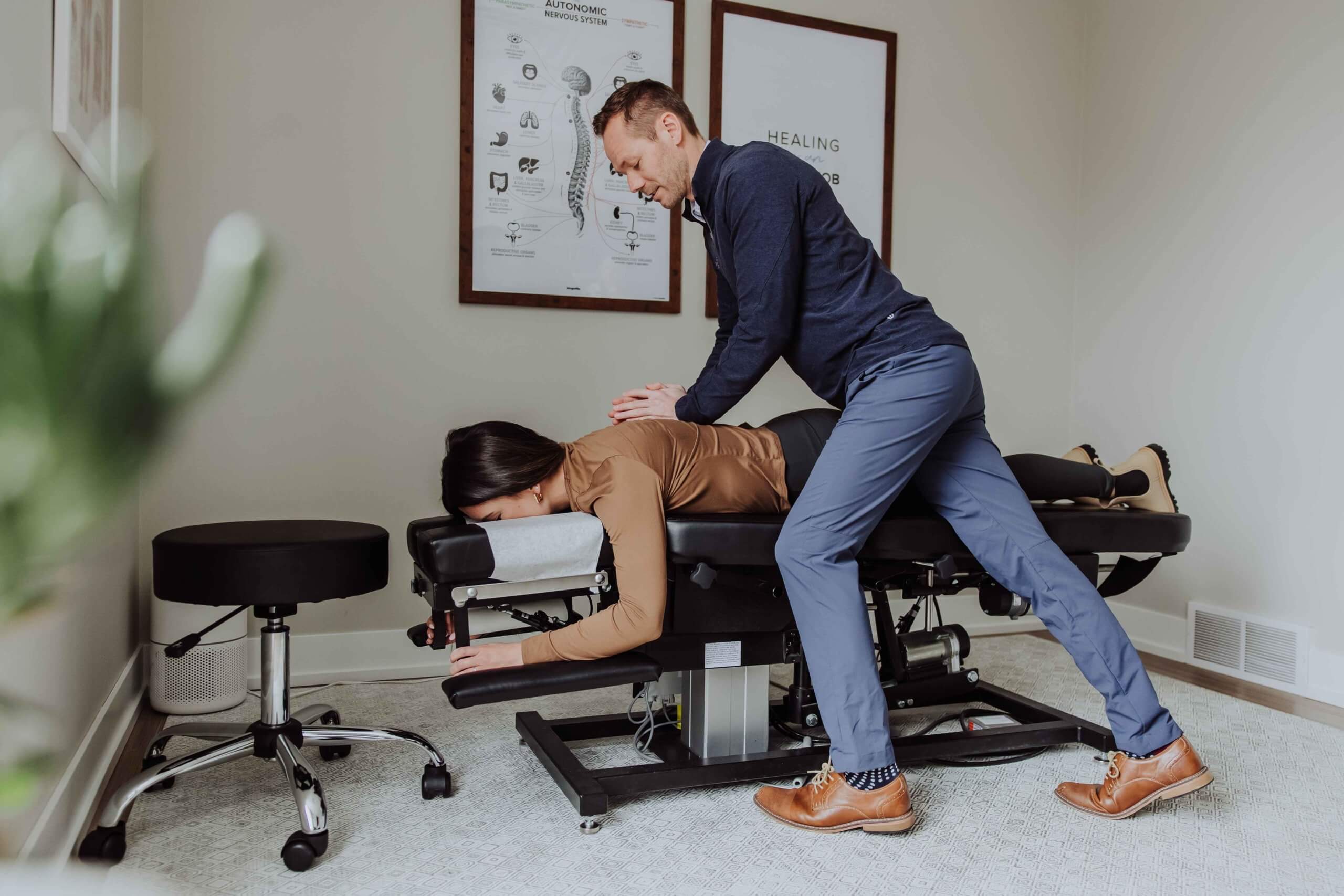 Chiropractor massaging for pain relief | Wellness Co. | Zeeland, MI
